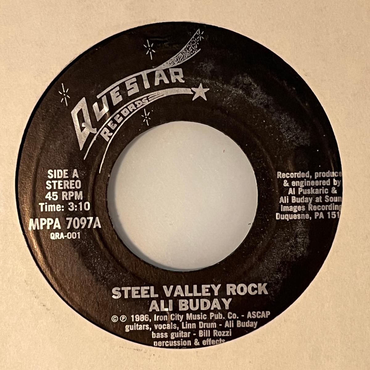 Ali Buday - Steel Valley Rock / (Everybody Wants) A Piece Of The Action 7"